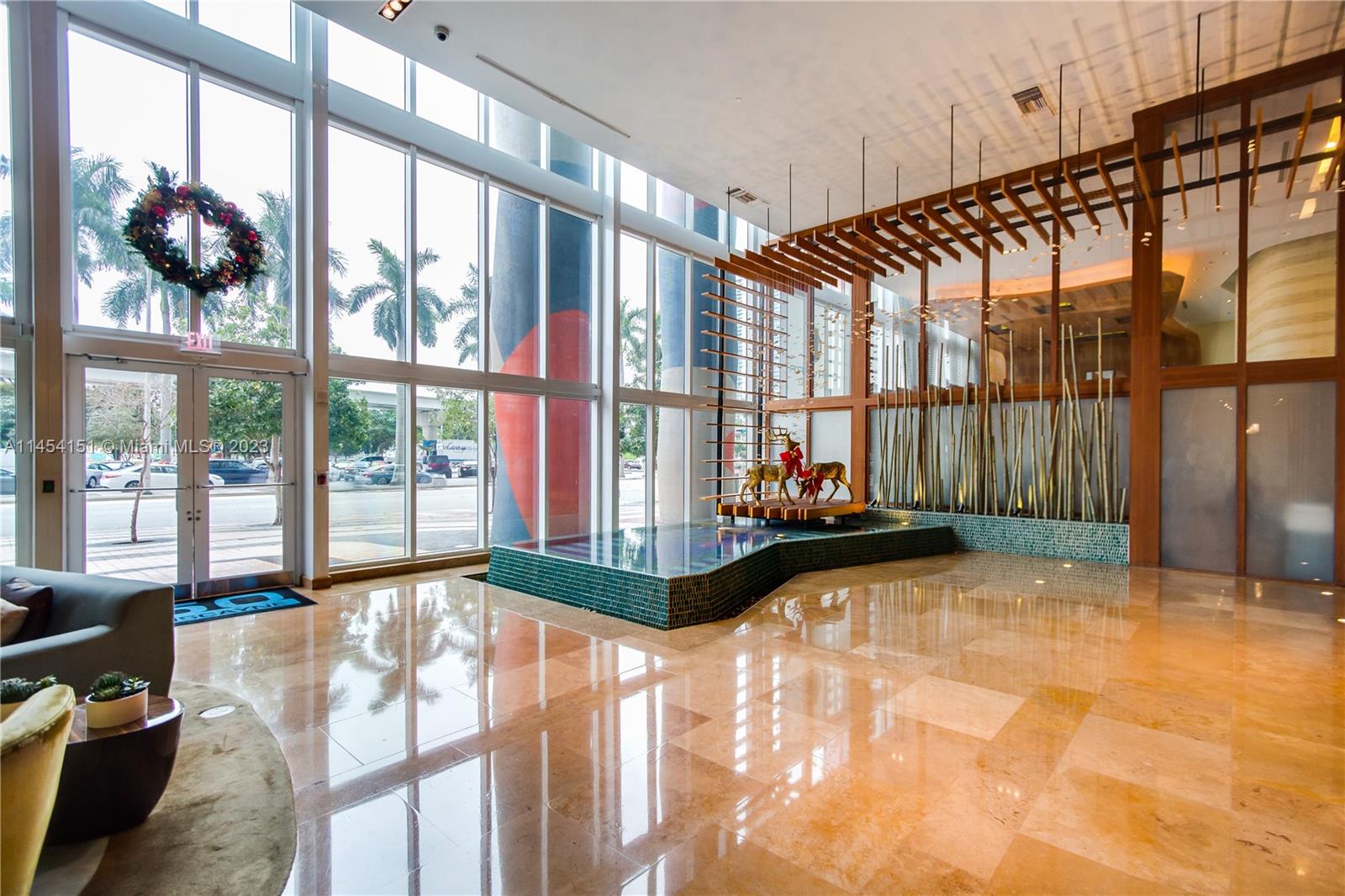 50 Biscayne Boulevard, Unit 3104 Miami, FL 33132 - Photo 4 of 52 a view of a living room and floor to ceiling window wooden floor