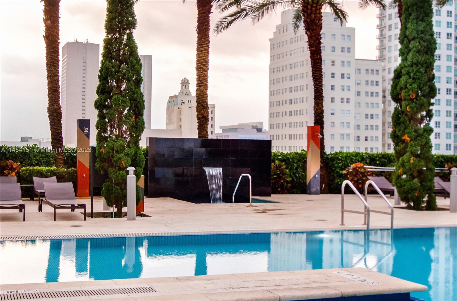 50 Biscayne Boulevard, Unit 3104 Miami, FL 33132 - Photo 41 of 52 a view of balcony with two chairs and a potted plant