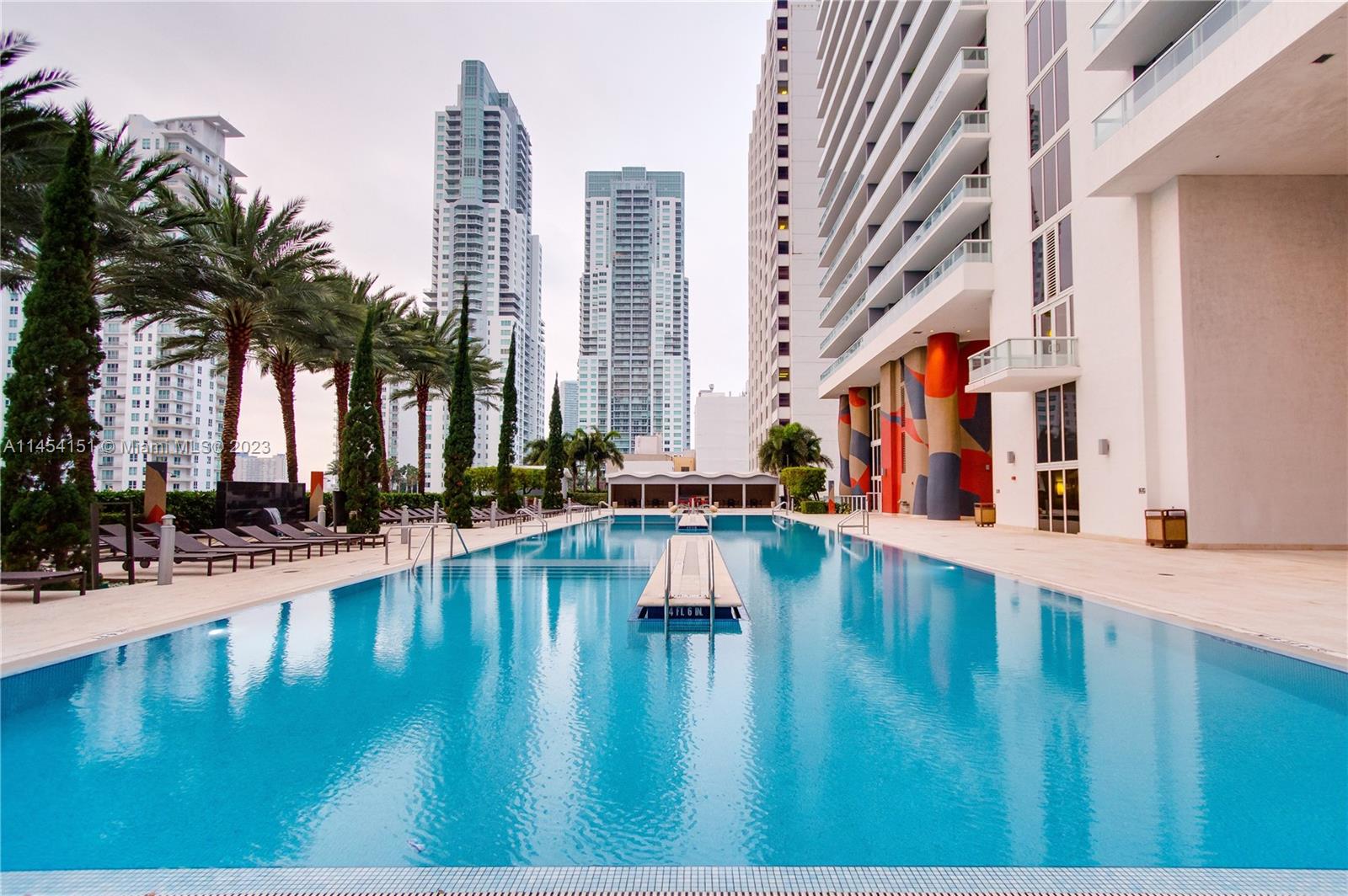 50 Biscayne Boulevard, Unit 3104 Miami, FL 33132 - Photo 42 of 52 a swimming pool with outdoor seating and yard