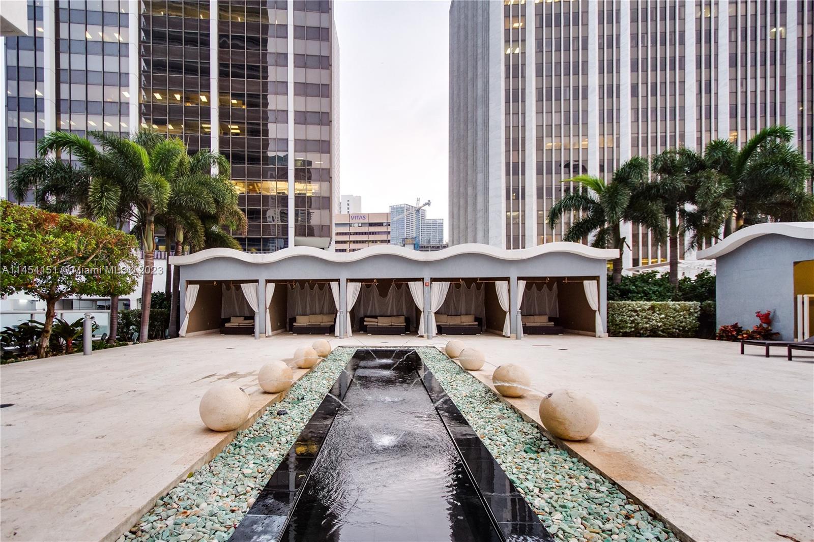 50 Biscayne Boulevard, Unit 3104 Miami, FL 33132 - Photo 43 of 52 a view of a swimming pool with a lounge chairs
