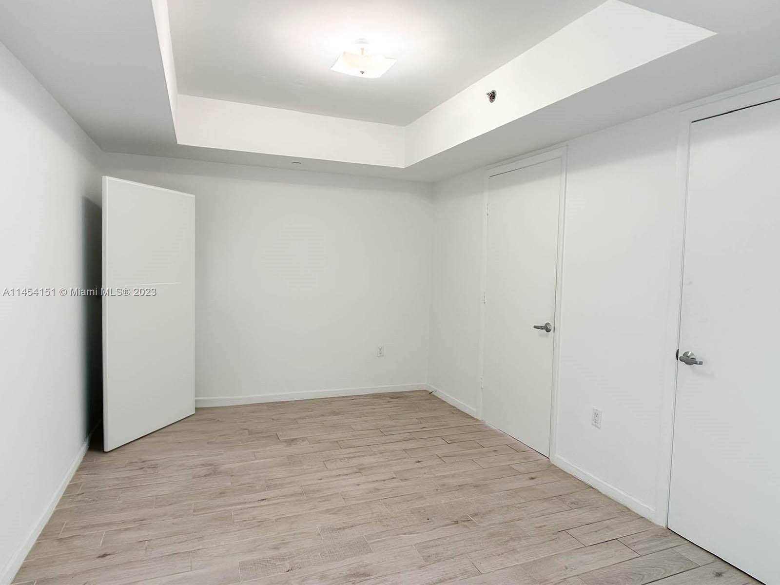 50 Biscayne Boulevard, Unit 3104 Miami, FL 33132 - Photo 10 of 52 wooden floor in an empty room