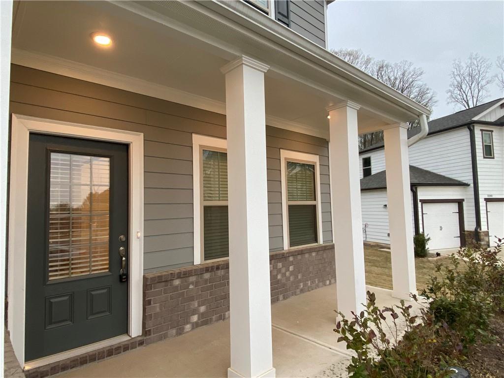 3290 Summerpoint Crossing Cumming, GA 30028 - Photo 4 of 39 front view of a house with a glass door