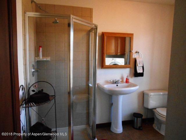 805 Randolph Avenue Rifle, CO 81650 - Photo 11 of 20 a bathroom with a sink toilet and shower