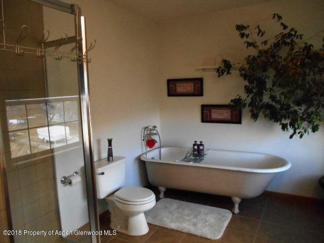 805 Randolph Avenue Rifle, CO 81650 - Photo 12 of 20 a bathroom with a sink toilet and shower