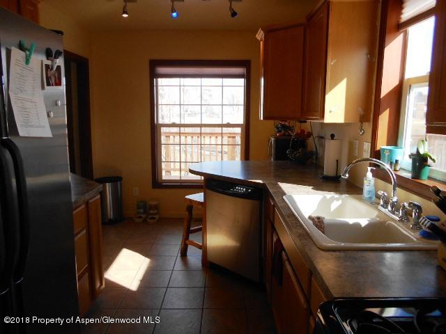805 Randolph Avenue Rifle, CO 81650 - Photo 7 of 20 a dining room with furniture and a window