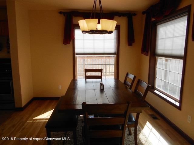 805 Randolph Avenue Rifle, CO 81650 - Photo 8 of 20 a view of a dining room with furniture window and wooden floor