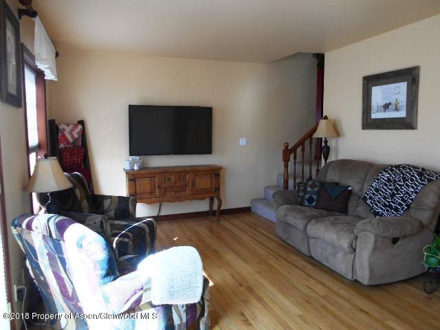 805 Randolph Avenue Rifle, CO 81650 - Photo 9 of 20 a living room with furniture and a flat screen tv