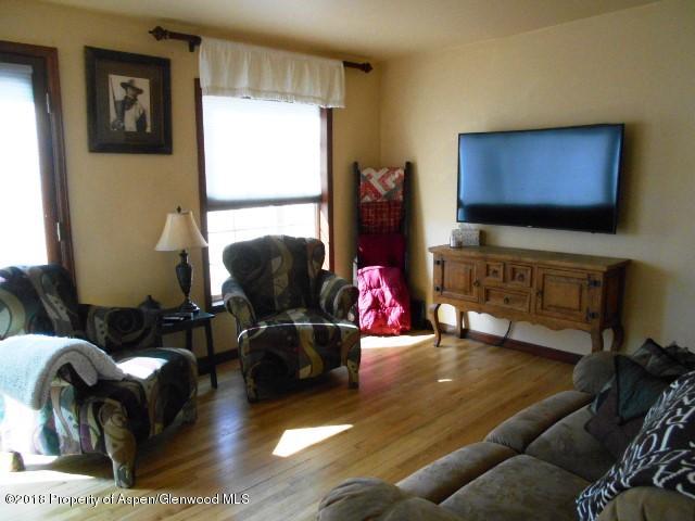 805 Randolph Avenue Rifle, CO 81650 - Photo 10 of 20 a living room with furniture and a flat screen tv