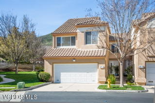 697 Lariate Lane, Unit A Simi Valley, CA 93065 - Photo 1 of 17 a front view of a house with a garden
