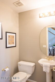 697 Lariate Lane, Unit A Simi Valley, CA 93065 - Photo 12 of 17 a white toilet sitting next to a bathroom sink