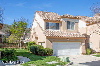 697 Lariate Lane, Unit A Simi Valley, CA 93065 - Photo 3 of 17 a front view of a house with a garden