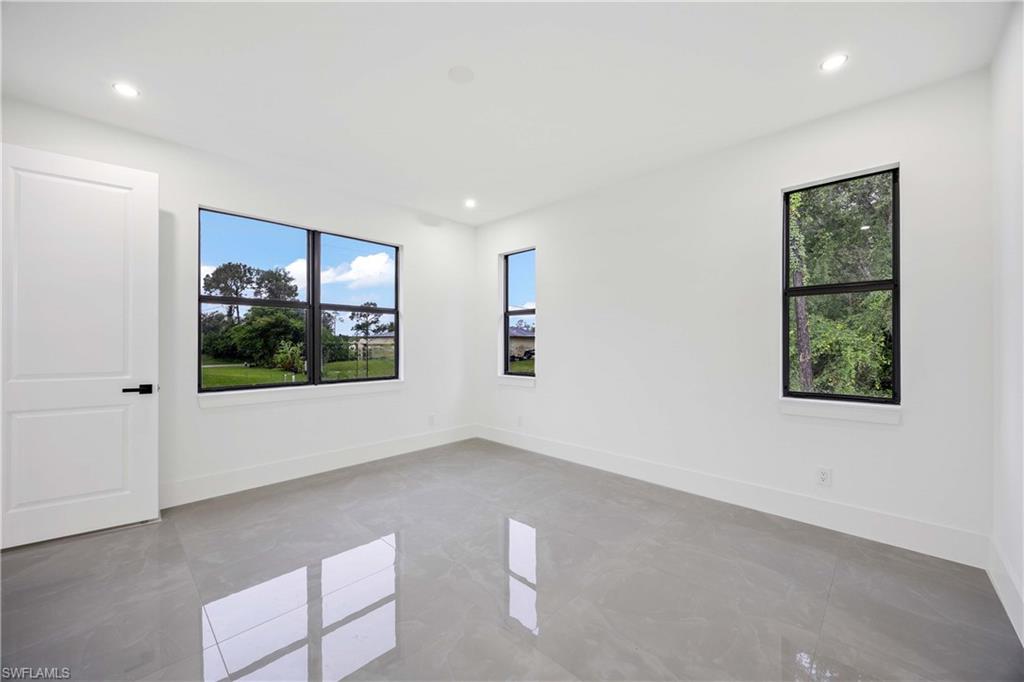 3908 Sunset Road Lehigh Acres, FL 33971 - Photo 16 of 30 a view of an empty room with a window