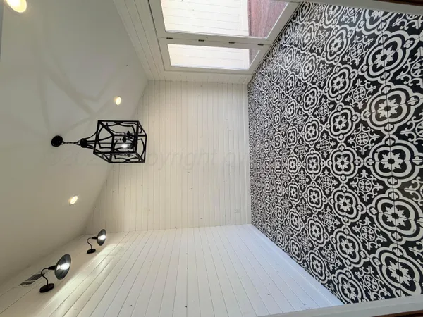 a bathroom with a bathtub and shower