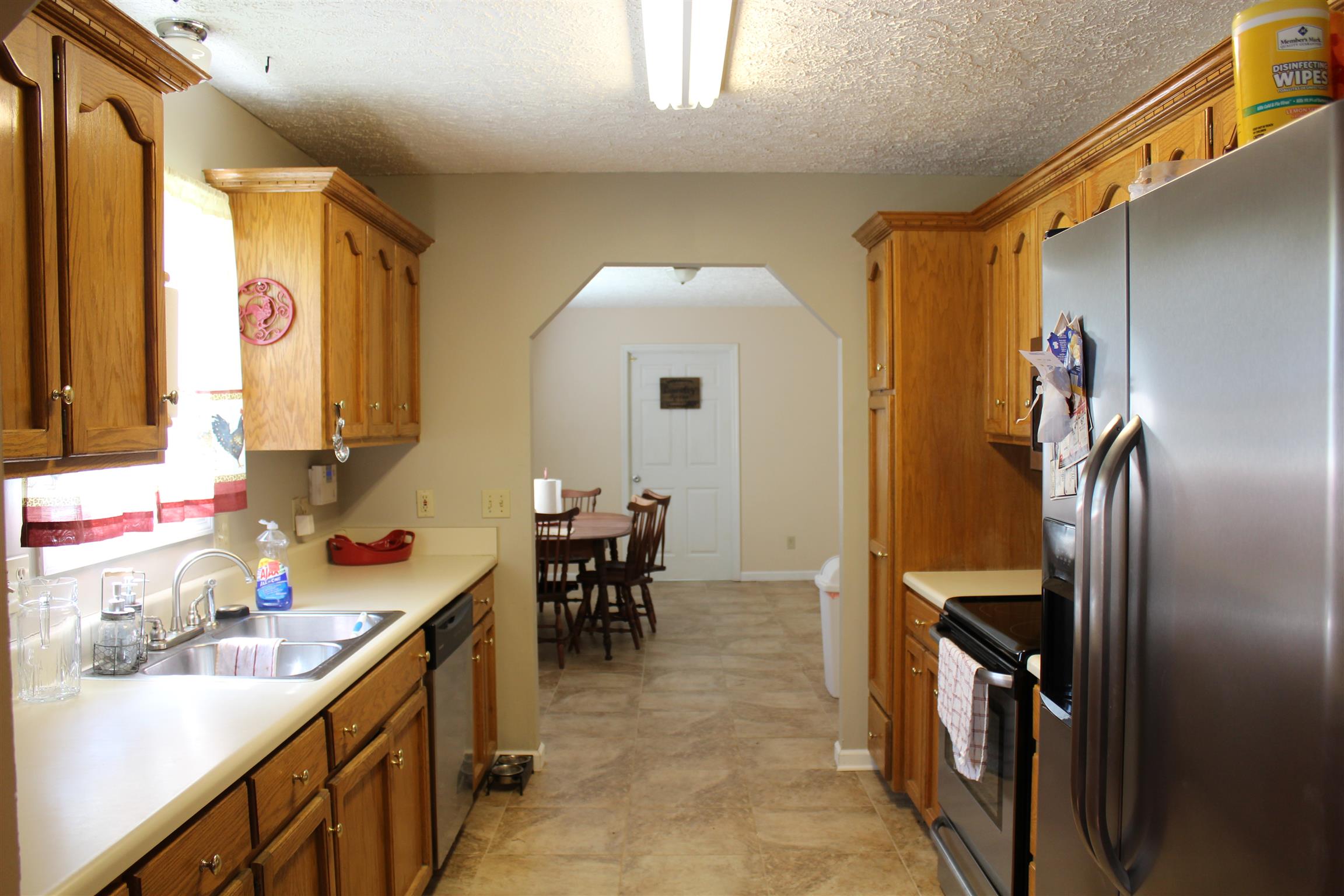 2676 Wayside Road Manchester, TN 37355 - Photo 3 of 16 a kitchen with granite countertop a sink cabinets and stainless steel appliances