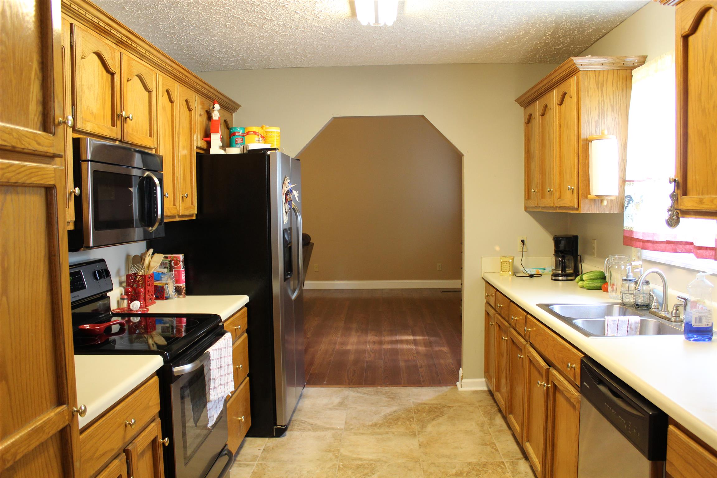 2676 Wayside Road Manchester, TN 37355 - Photo 4 of 16 a kitchen with stainless steel appliances a sink stove and refrigerator