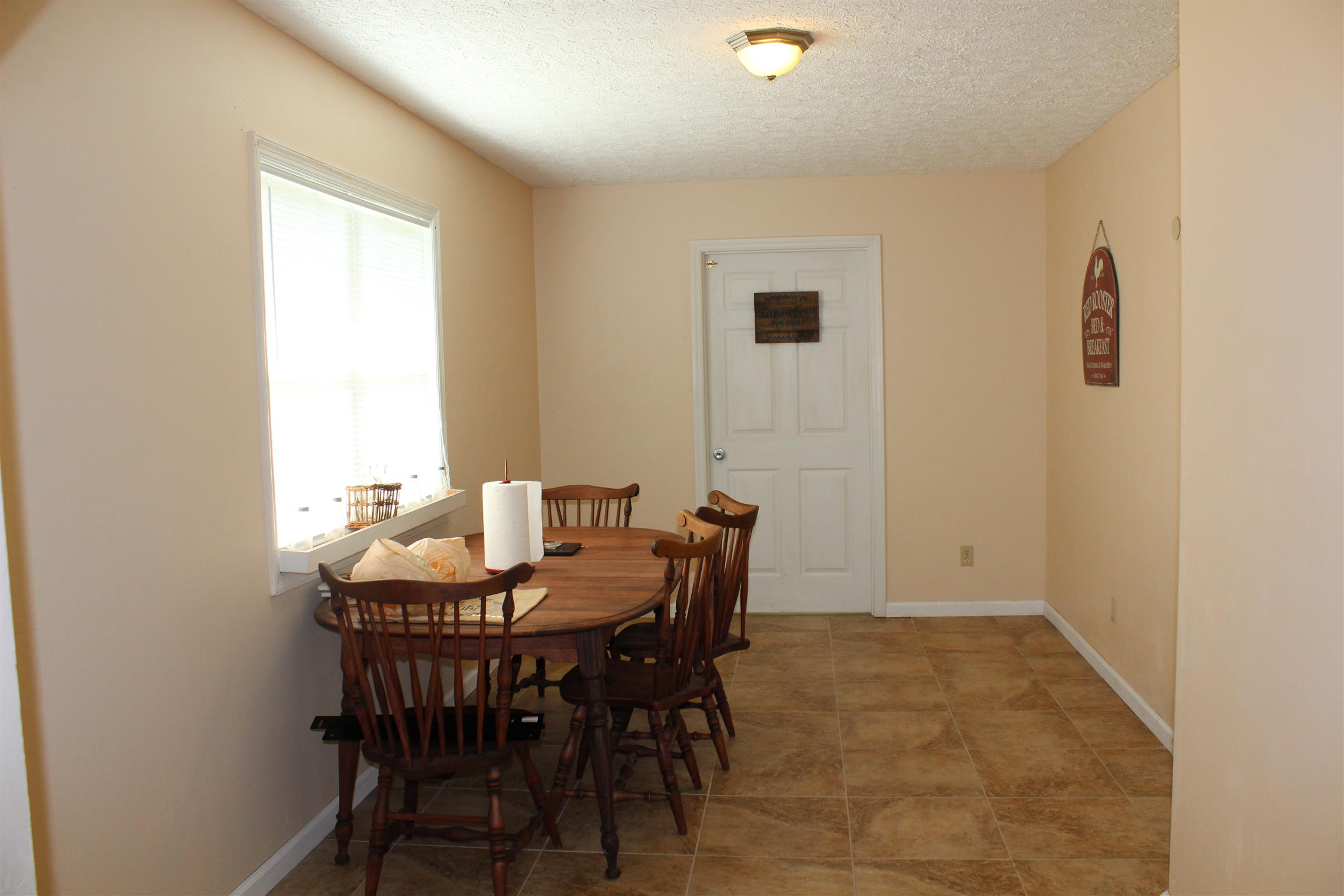 2676 Wayside Road Manchester, TN 37355 - Photo 5 of 16 a view of a dining room with furniture and window