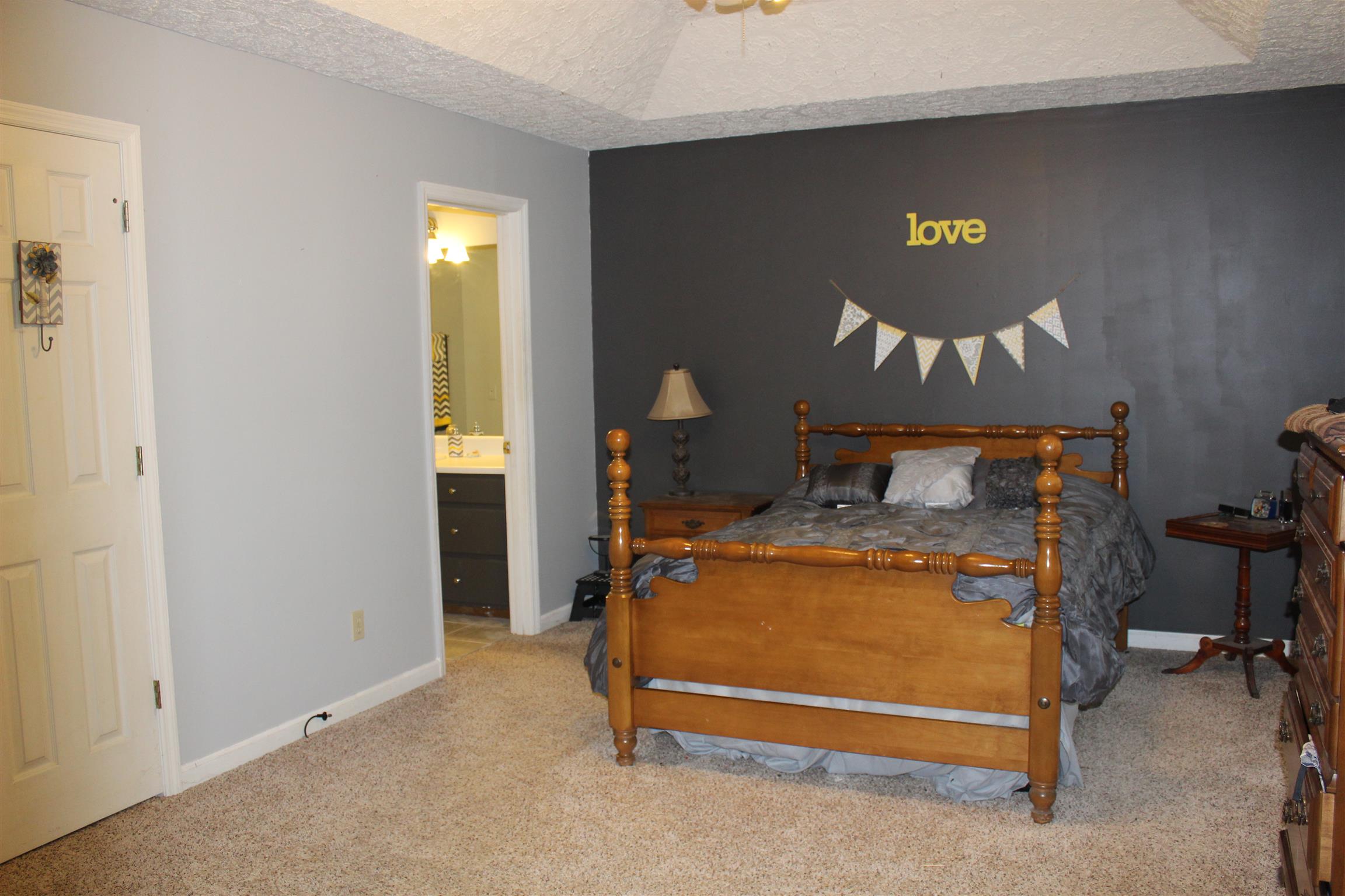 2676 Wayside Road Manchester, TN 37355 - Photo 7 of 16 a bedroom with a bed and a lamp on table