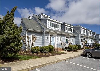 25 Henlopen Gardens, Unit 25 Lewes, DE 19958 - Photo 1 of 5 a car parked in front of a building