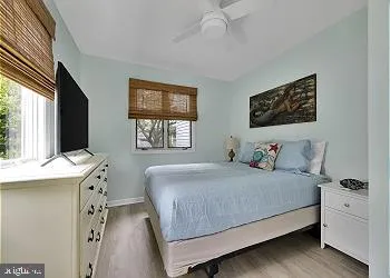 a bedroom with a bed and a desk