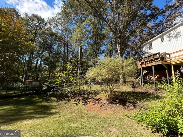 a front view of house with yard space and seating area
