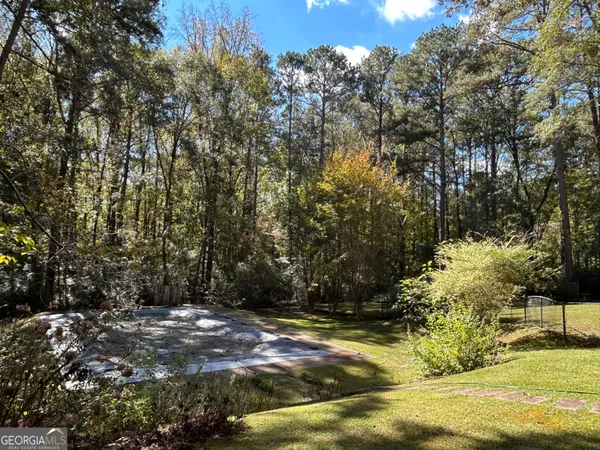a backyard of a house with lots of green space
