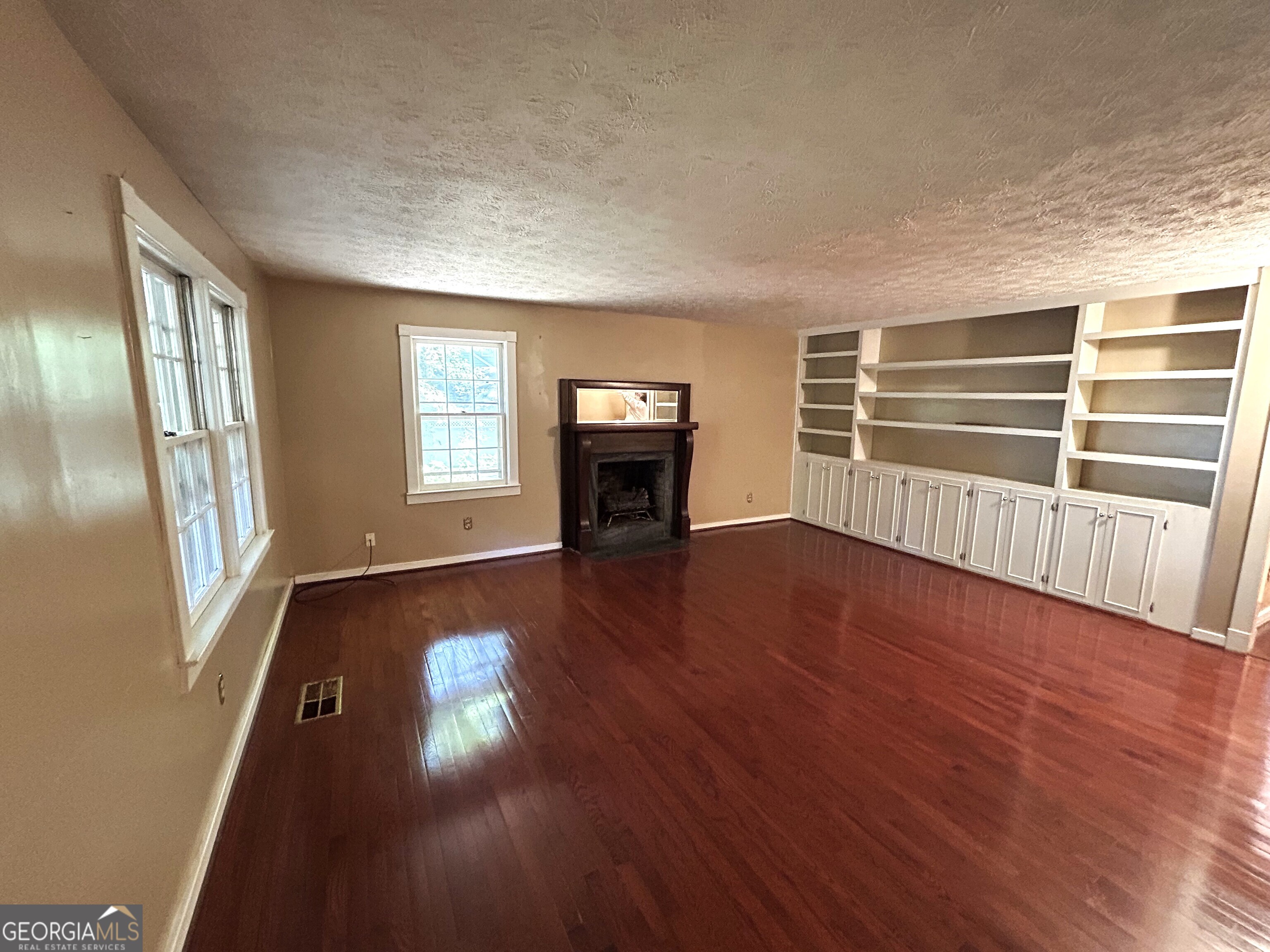 104 Spring Valley Drive LaGrange, GA 30240 - Photo 18 of 55 wooden floor in an empty room with a window