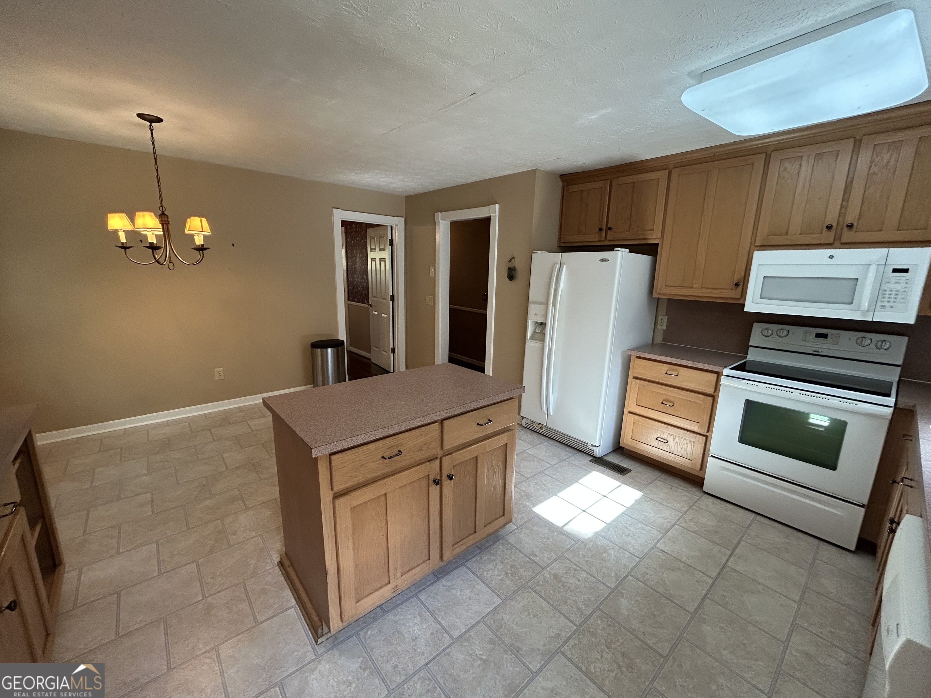 104 Spring Valley Drive LaGrange, GA 30240 - Photo 24 of 55 a kitchen with stainless steel appliances granite countertop a stove a refrigerator and a stove