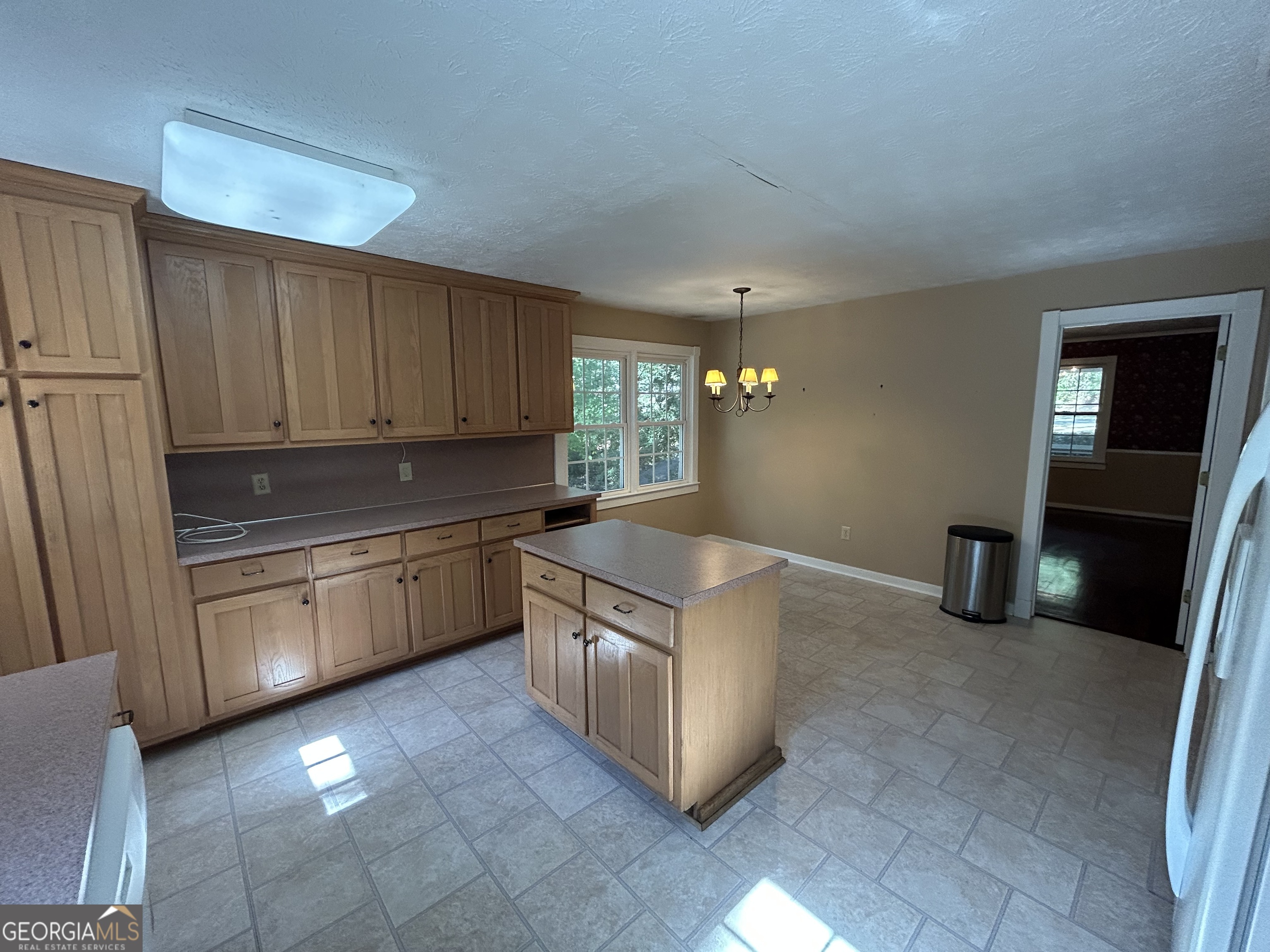 104 Spring Valley Drive LaGrange, GA 30240 - Photo 25 of 55 a kitchen with stainless steel appliances granite countertop a stove a sink and a refrigerator