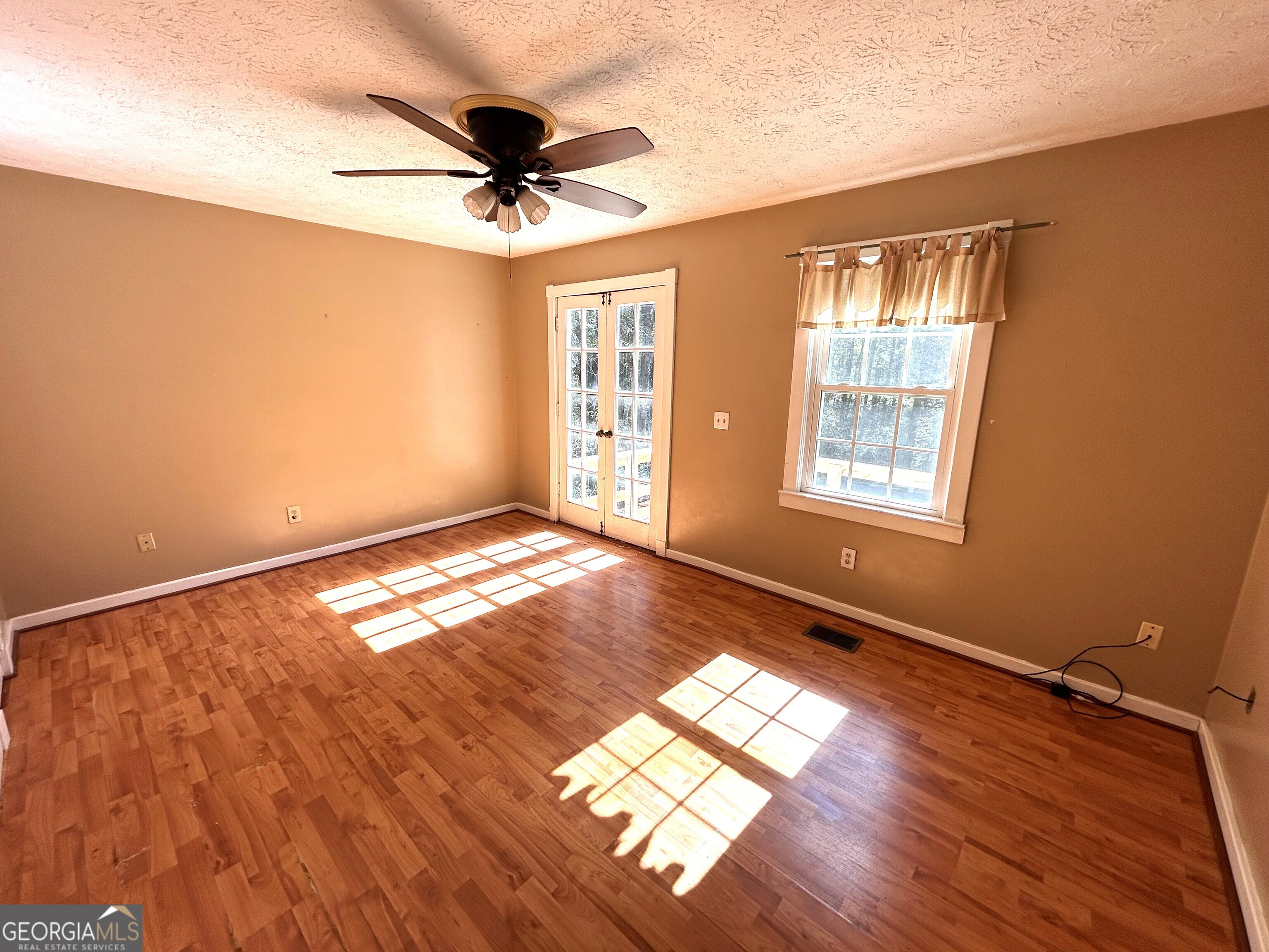 104 Spring Valley Drive LaGrange, GA 30240 - Photo 27 of 55 a view of empty room with wooden floor and fan