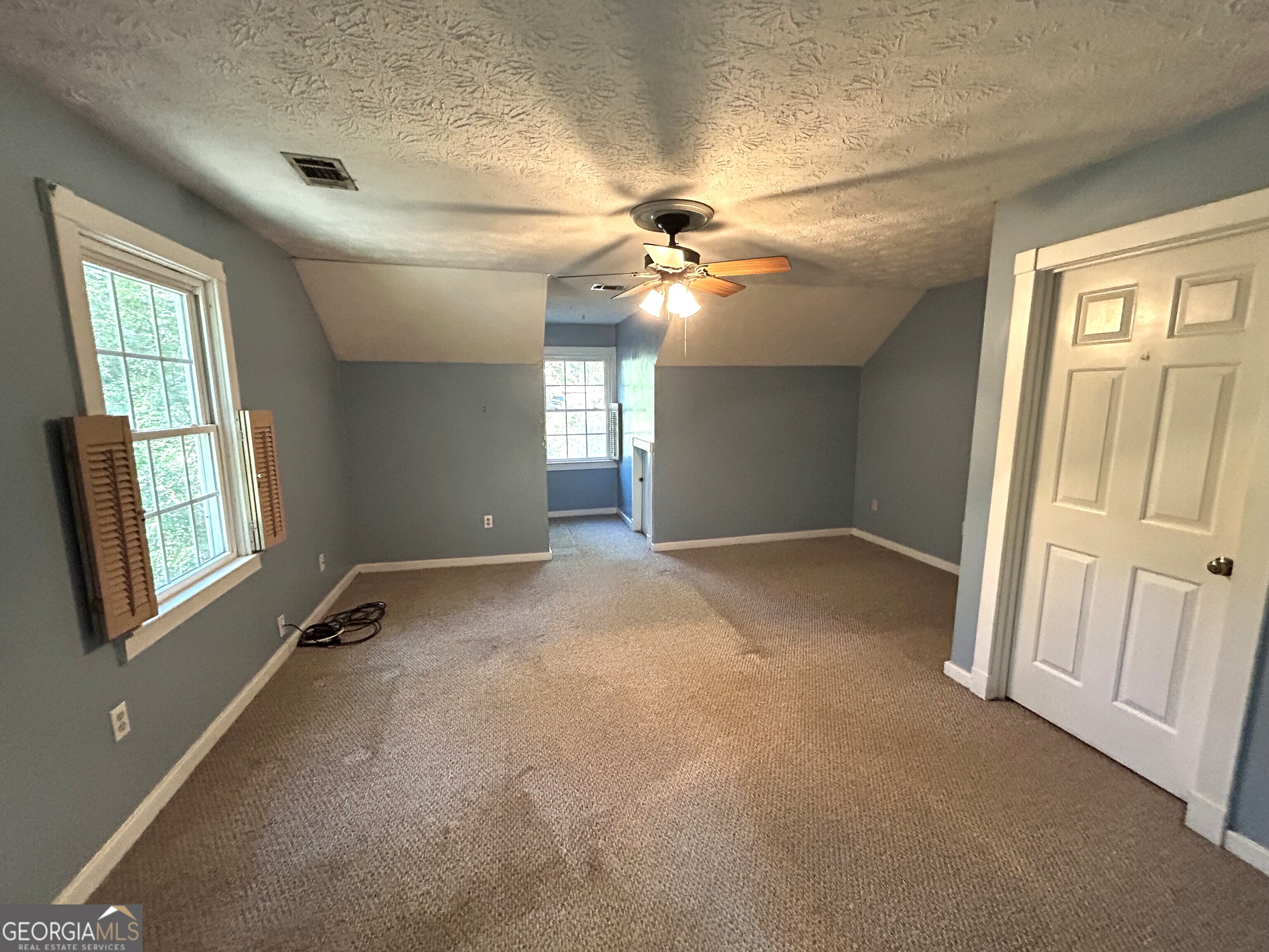 104 Spring Valley Drive LaGrange, GA 30240 - Photo 32 of 55 a view of a livingroom with a ceiling fan and window