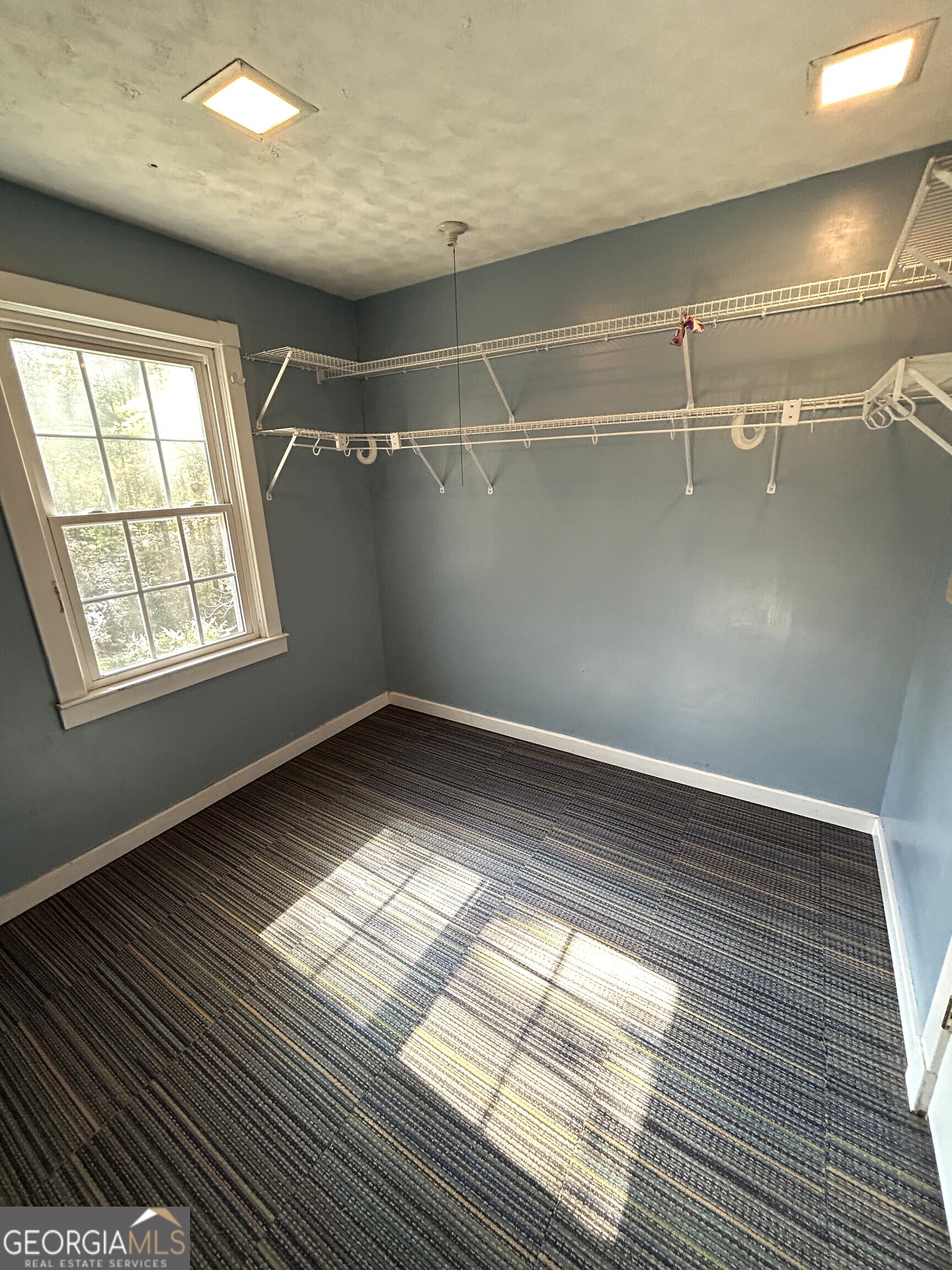 104 Spring Valley Drive LaGrange, GA 30240 - Photo 33 of 55 an empty room with wooden floor and windows