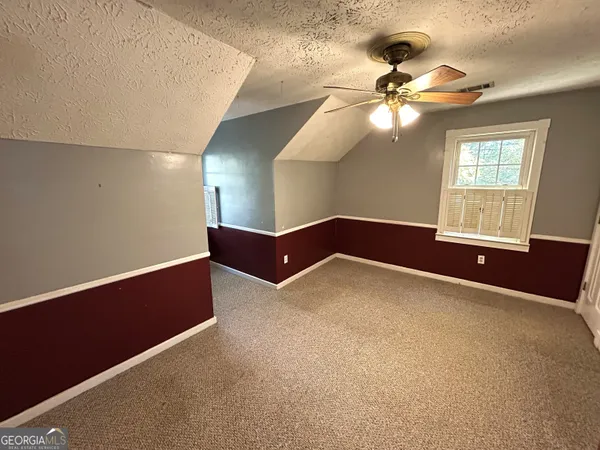 a bathroom with a tub shower vanity and a sink