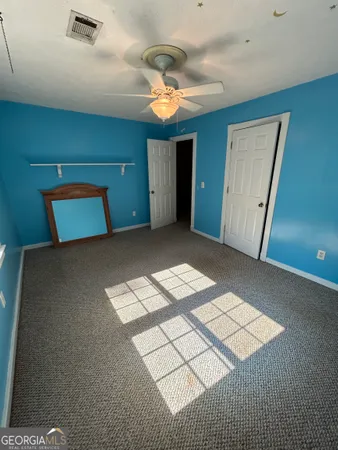 a view of empty room with workspace and window