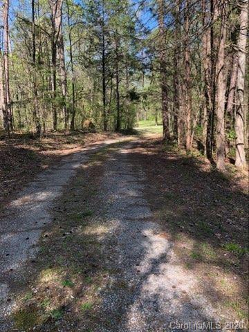 4112 Tater Ridge Road Concord, NC 28025 - Photo 4 of 4 a view of dirt yard with a large tree