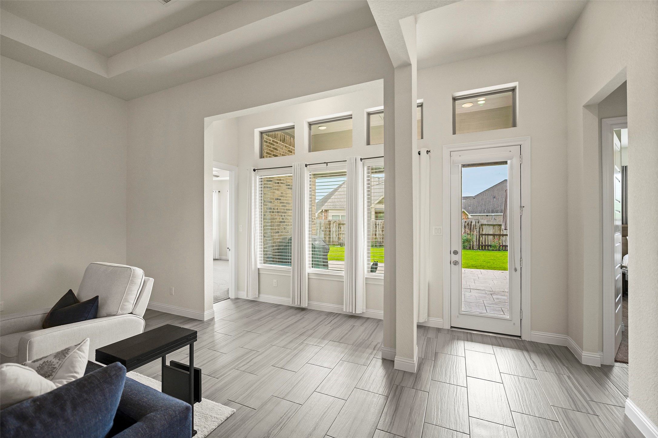 20330 Rosegold Way Spring, TX 77379 - Photo 18 of 48 Abundant natural light fills the living area through large windows overlooking the backyard.