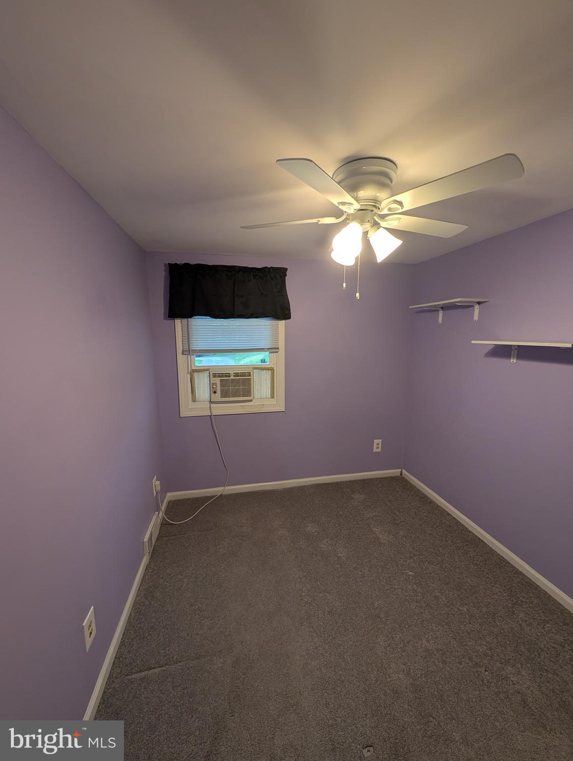 1412 Simpson Street Marcus Hook, PA 19061 - Photo 14 of 35 a view of a room with a chandelier fan and windows
