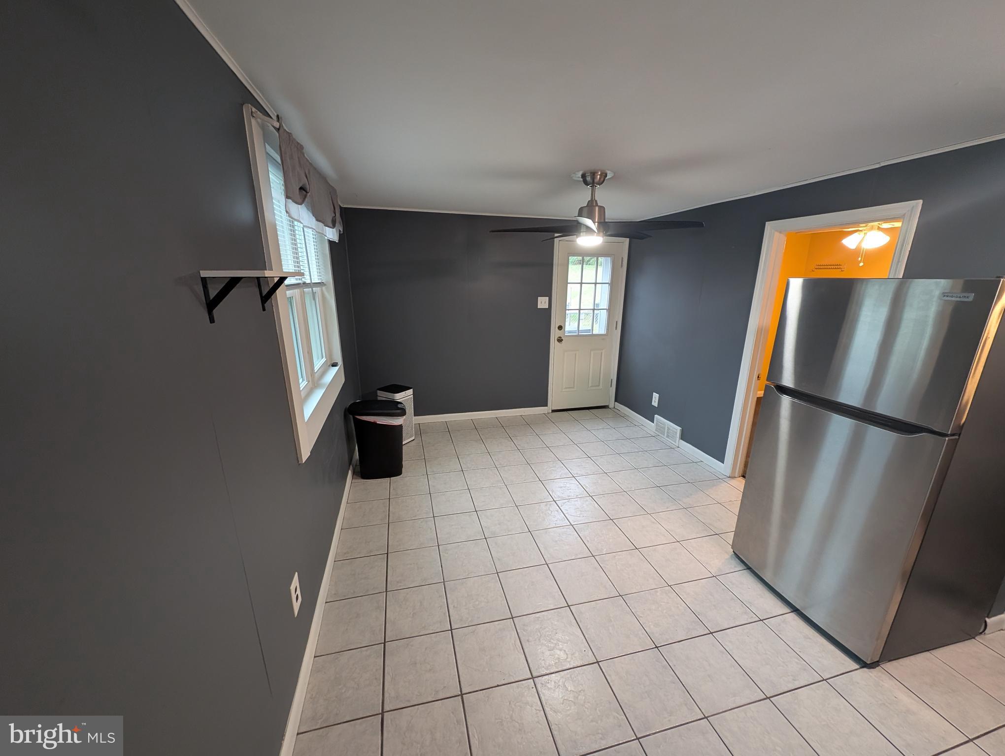 1412 Simpson Street Marcus Hook, PA 19061 - Photo 17 of 35 a view of a refrigerator in kitchen and entryway in a room
