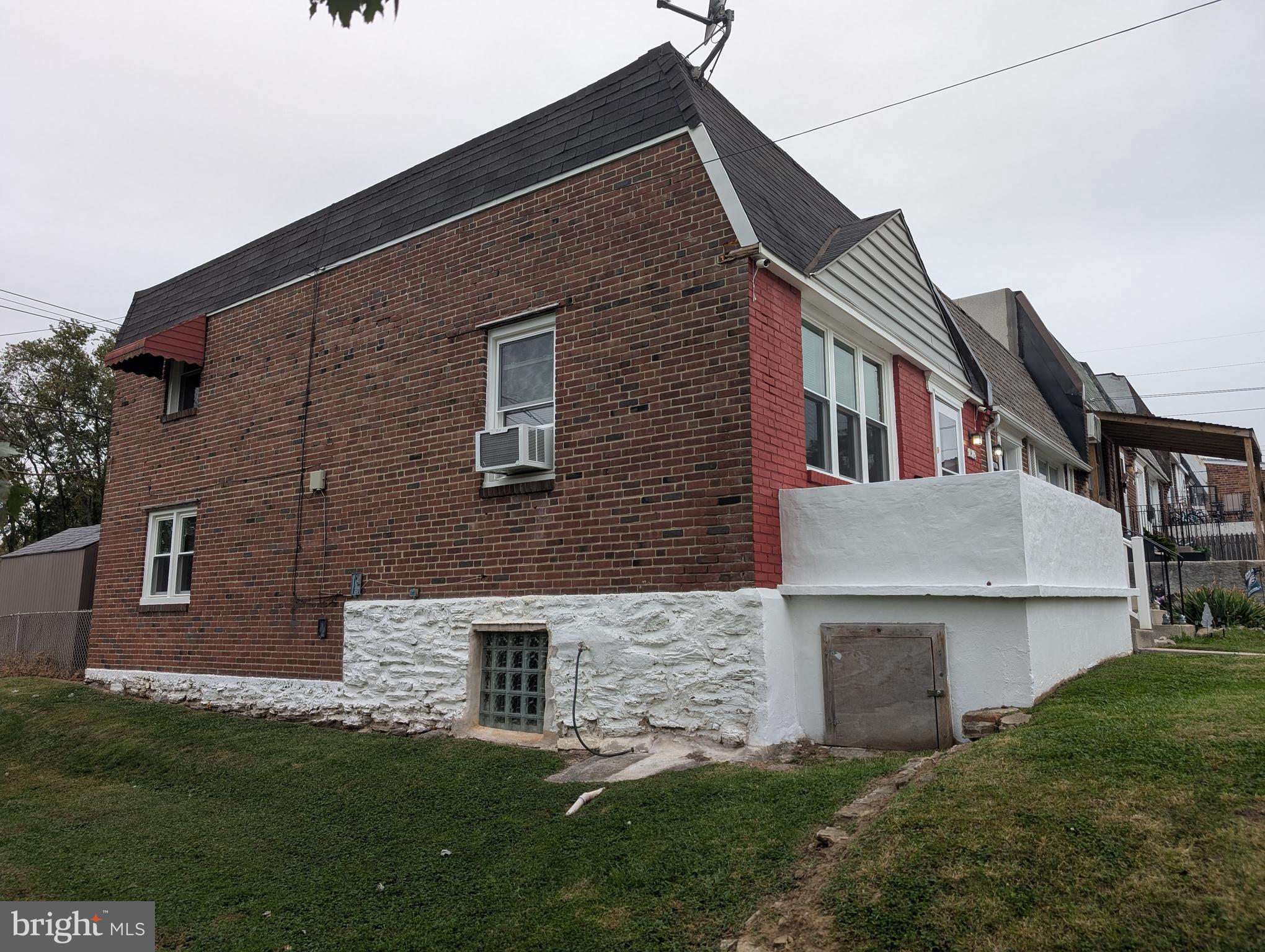 1412 Simpson Street Marcus Hook, PA 19061 - Photo 4 of 35 a front view of a house with a garden