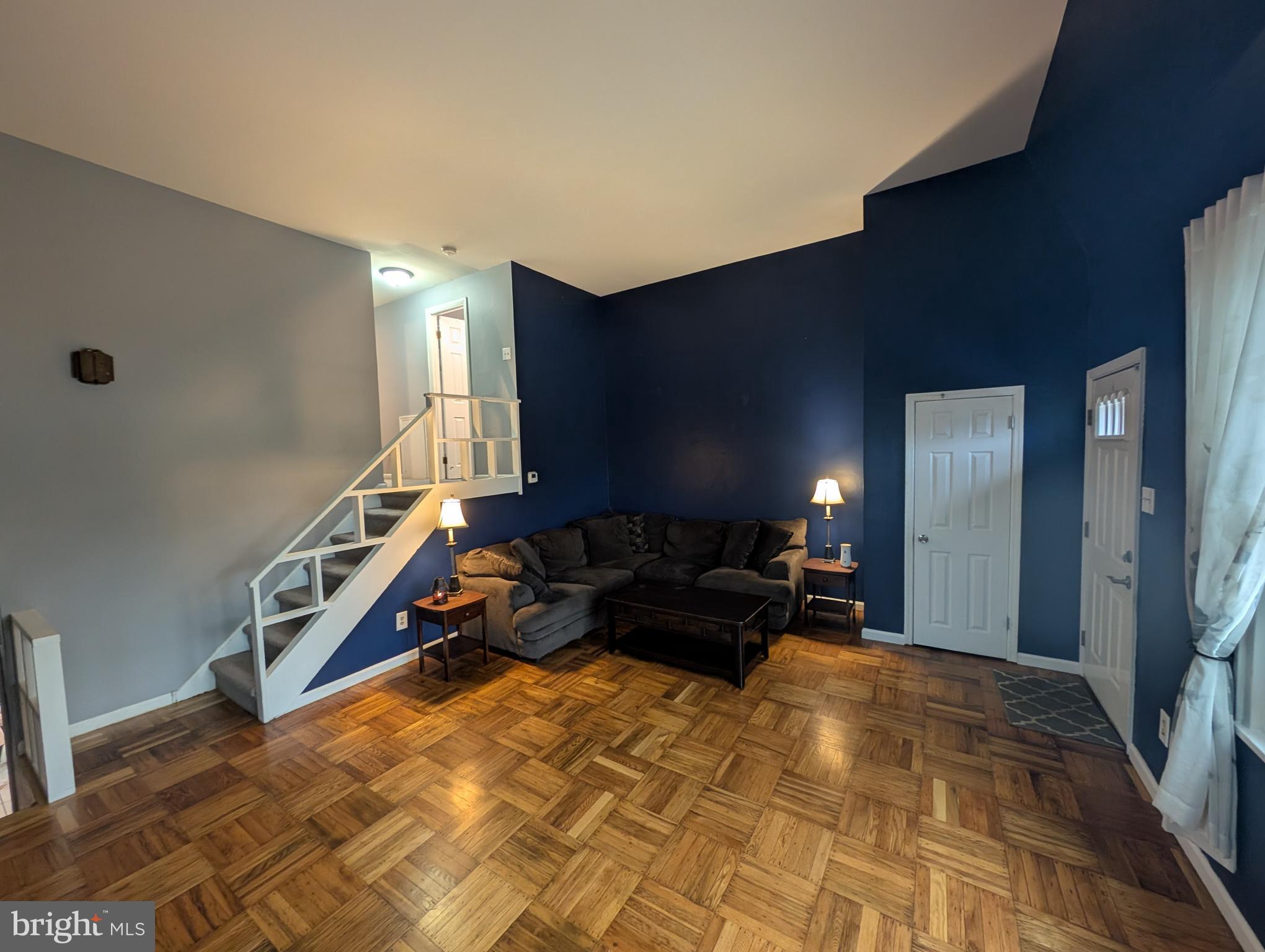 1412 Simpson Street Marcus Hook, PA 19061 - Photo 7 of 35 a living room with furniture and a flat screen tv