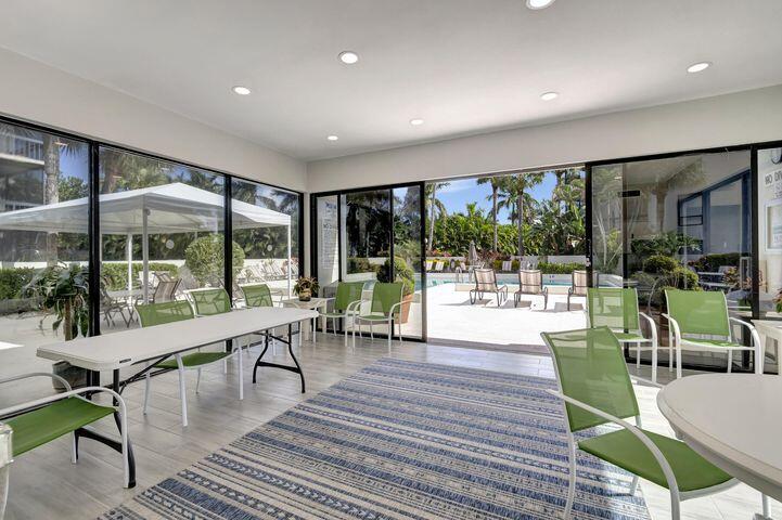 2500 Presidential Way, Unit 405 West Palm Beach, FL 33401 - Photo 26 of 28 a living room with furniture and a large window