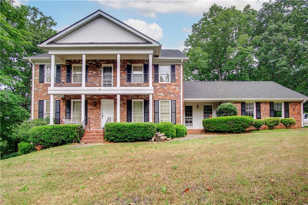 46 Devonshire Drive Southeast Rome, GA 30161 - Photo 1 of 1 front view of a house next to a yard
