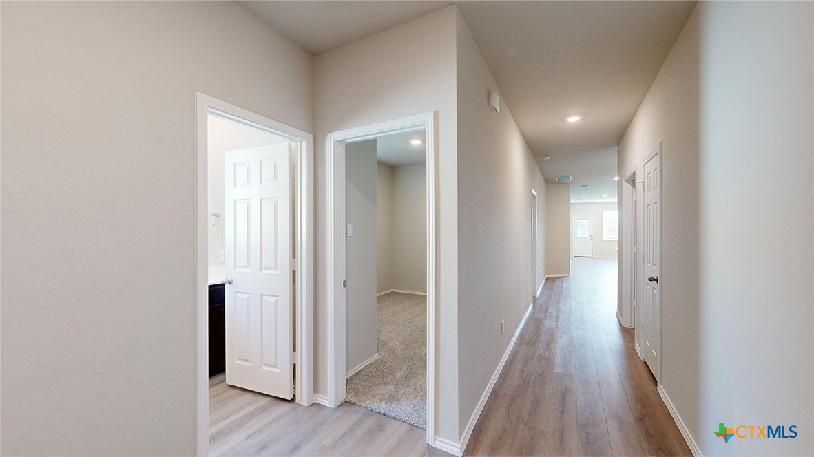 1110 Stone Vly Road Temple, TX 76502 - Photo 5 of 21 a view of a hallway with wooden floor