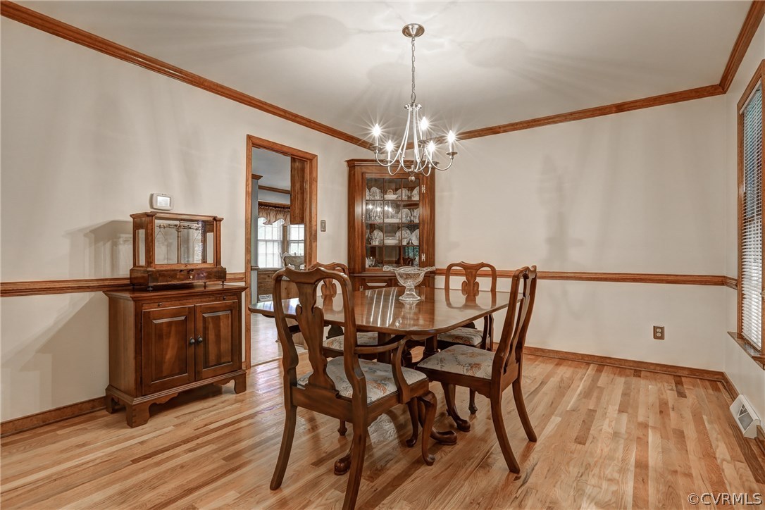 863 Watch Hill Road Midlothian, VA 23114 - Photo 11 of 38 a view of a dining room with furniture window and wooden floor