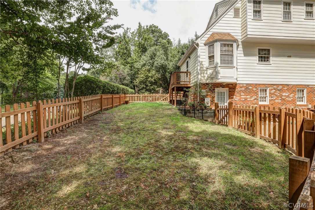 863 Watch Hill Road Midlothian, VA 23114 - Photo 14 of 38 a view of a backyard with wooden fence and a large tree