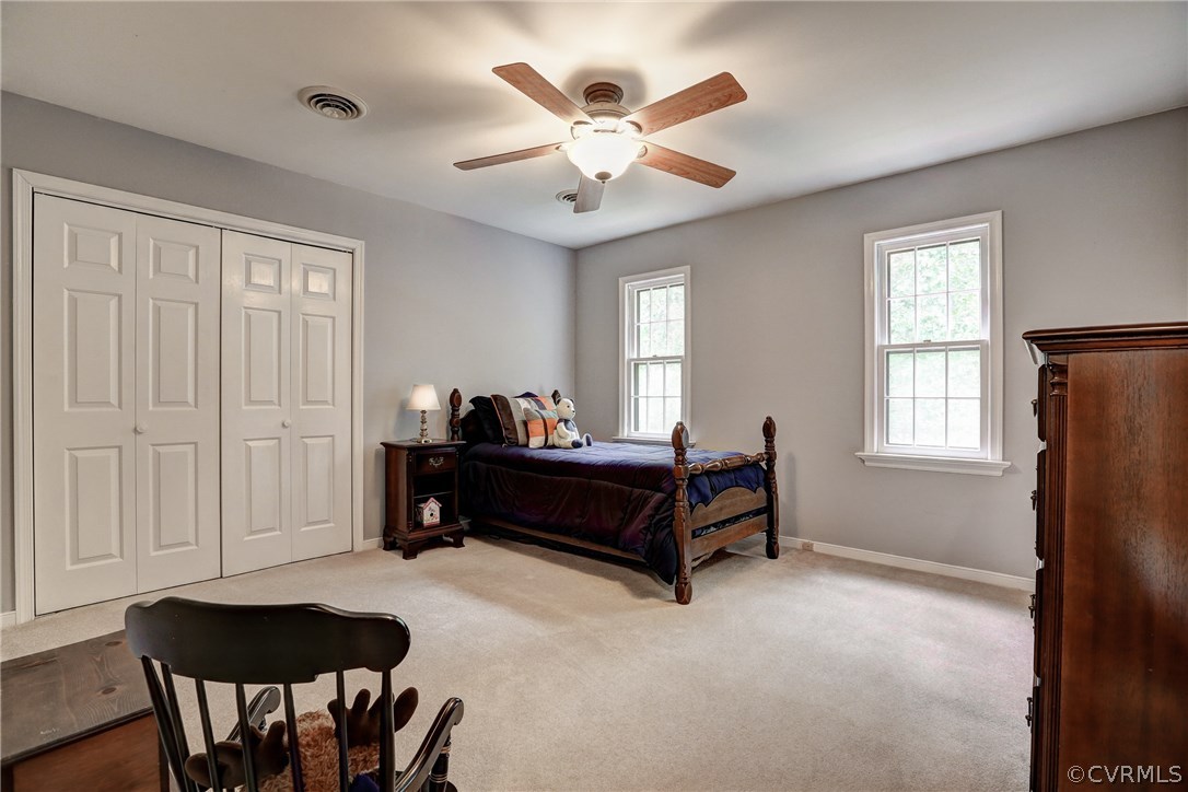 863 Watch Hill Road Midlothian, VA 23114 - Photo 24 of 38 a living room with furniture and a chandelier