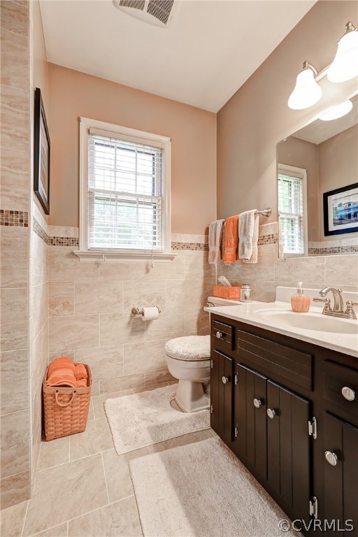863 Watch Hill Road Midlothian, VA 23114 - Photo 27 of 38 a bathroom with a granite countertop toilet a sink a mirror and a window