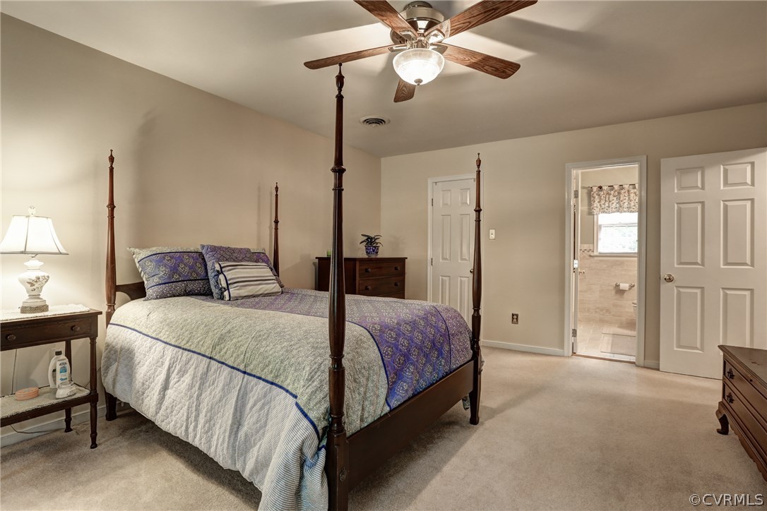 863 Watch Hill Road Midlothian, VA 23114 - Photo 30 of 38 a bedroom with a bed chandelier and a window
