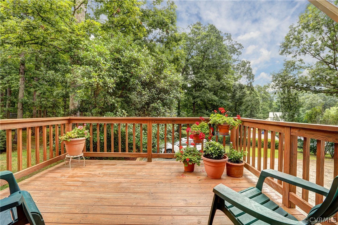863 Watch Hill Road Midlothian, VA 23114 - Photo 3 of 38 a view of a chairs and tables on the wooden deck