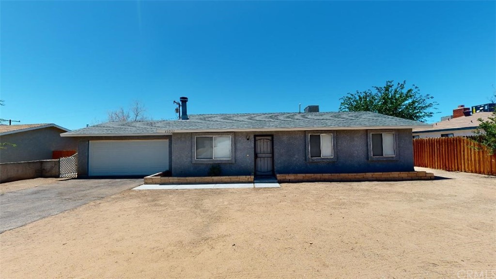 23931 Tahquitz Road Apple Valley, CA 92307 - Photo 1 of 1 a front view of house with yard