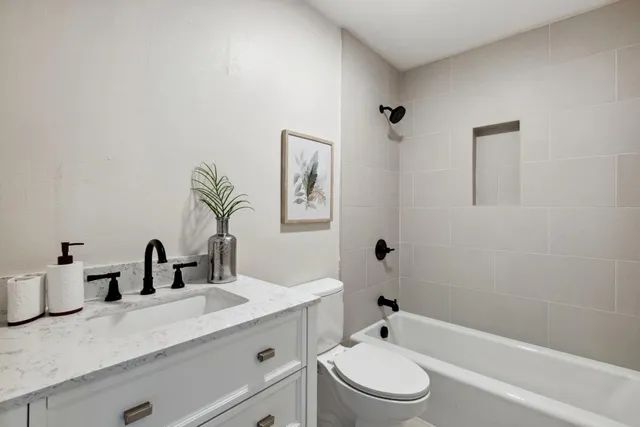 a bedroom with a bed and a table